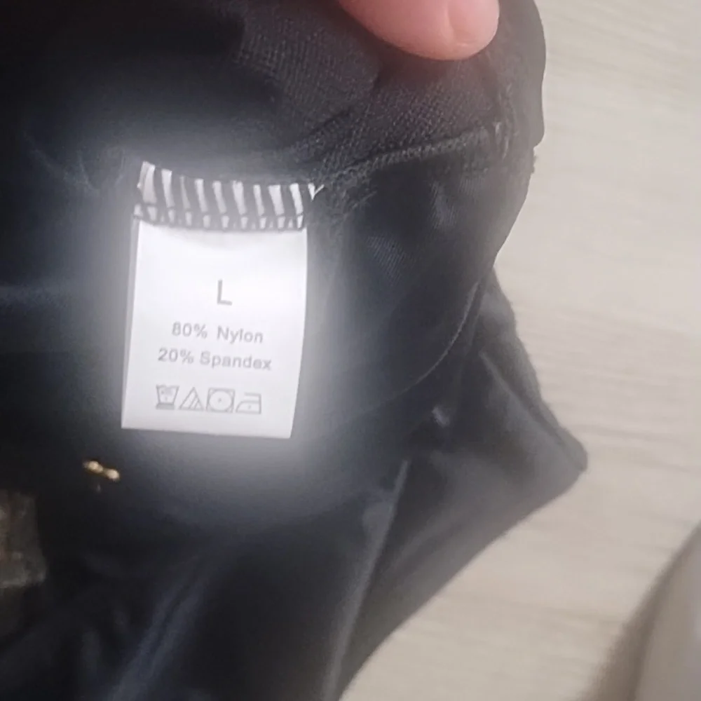 Elegant Black One-Piece Swimsuit with Gold Accents - Picture 2 of 5